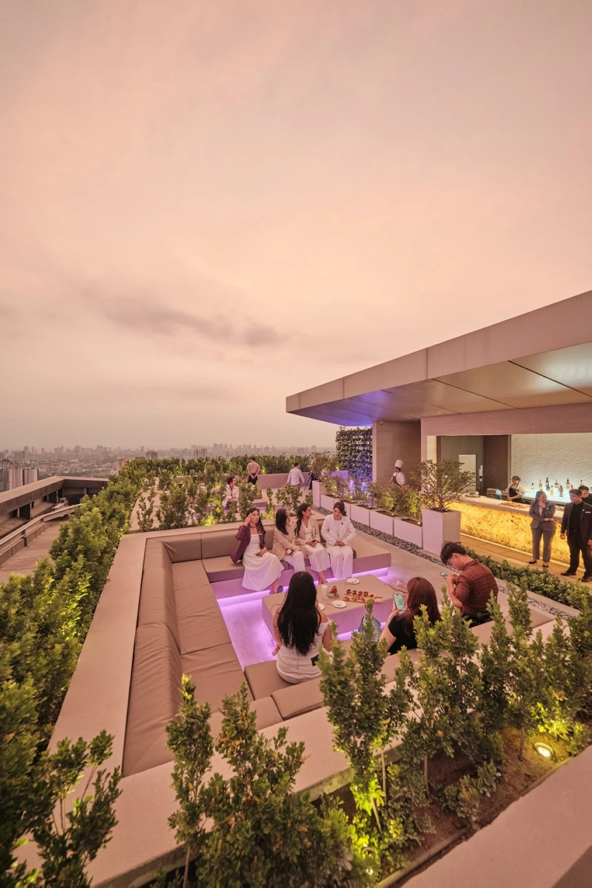 AC Bar on the 61st floor, offering rooftop city views, curated cocktails, and signature tapas.