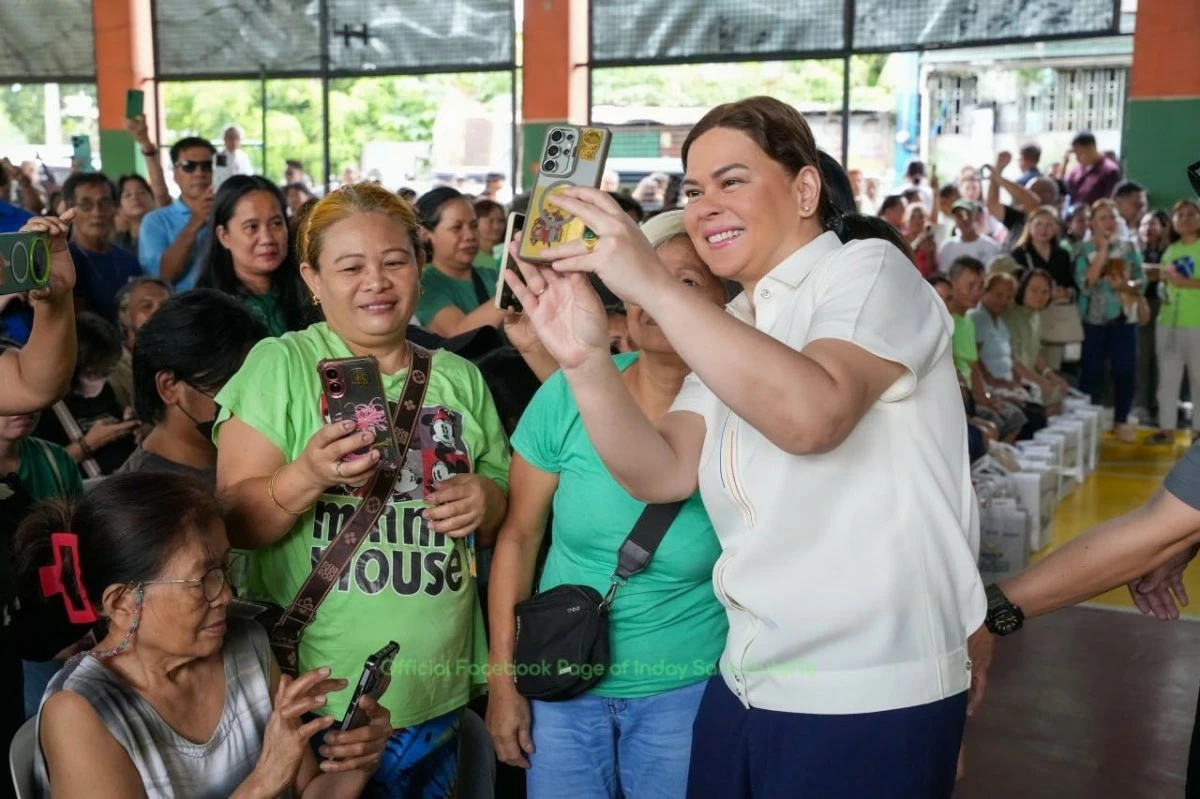 Vice President Sara Duterte joins the distribution of food boxes to LGBTQIA  community members and senior citizens in Barangay Gulod, Quezon City, as part of the OVP's RIICE Program and Kasarilayaan observance. (Photo from Inday Sara Duterte / Facebook)