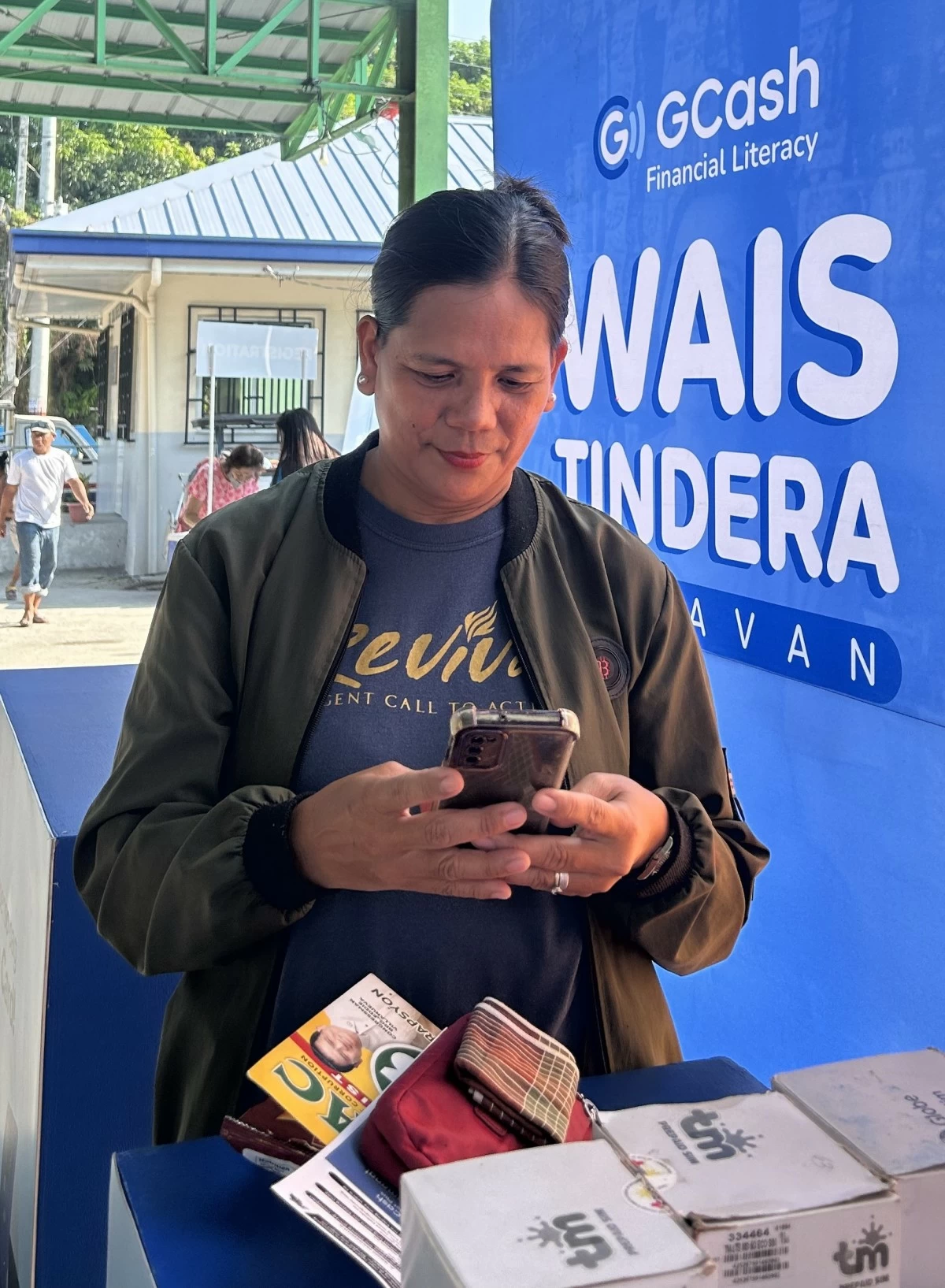 Amelyn Rafael visits the GLoan booth during the Wais Tindera Caravan in Brgy. Taugtog, Botolan, Zambales.