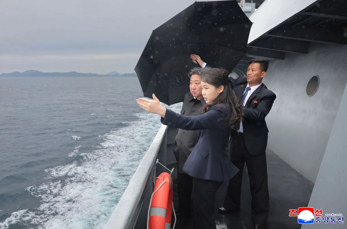 This photo provided by the North Korean government shows its leader Kim Jong Un, left, and his daughter observe the sea trials of its destroyer Kang Kon at an undisclosed location in North Korea, Thursday, June 4, 2026. Independent journalists were not given access to cover the event depicted in this image distributed by the North Korean government. The content of this image is as provided and cannot be independently verified. Korean language watermark on image as provided by source reads: "KCNA" which is the abbreviation for Korean Central News Agency. (Korean Central News Agency/Korea News Service via AP)