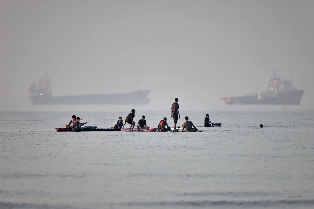 
PEOPLE gather on paddleboards in shallow water as cargo and service vessels are anchored in the Strait of Hormuz off Bandar Abbas, Iran, Monday, June 1, 2026. (Amirhosein Khorgooi/ISNA via AP)
