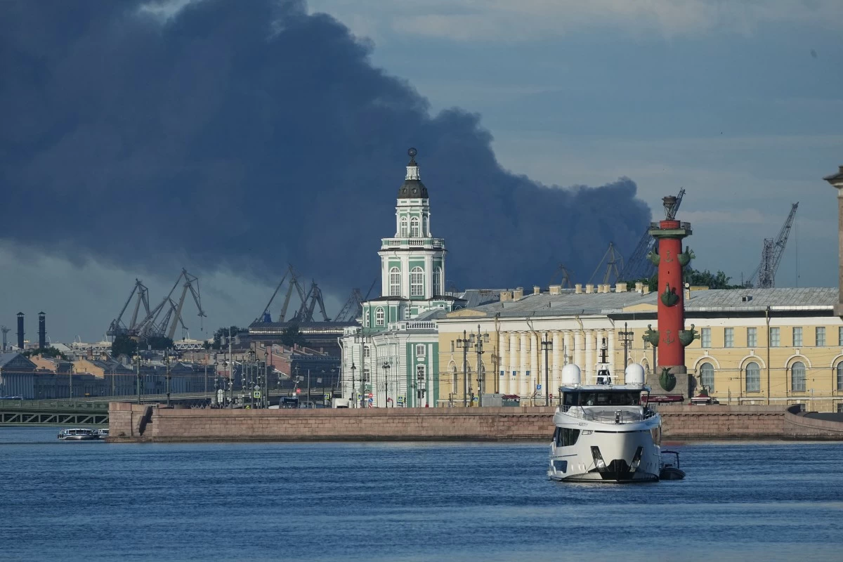 A plume of black smoke is seen over the port of St. Petersburg, Russia, Wednesday, June 3, 2026, after a Ukrainian drone attack. (AP Photo)