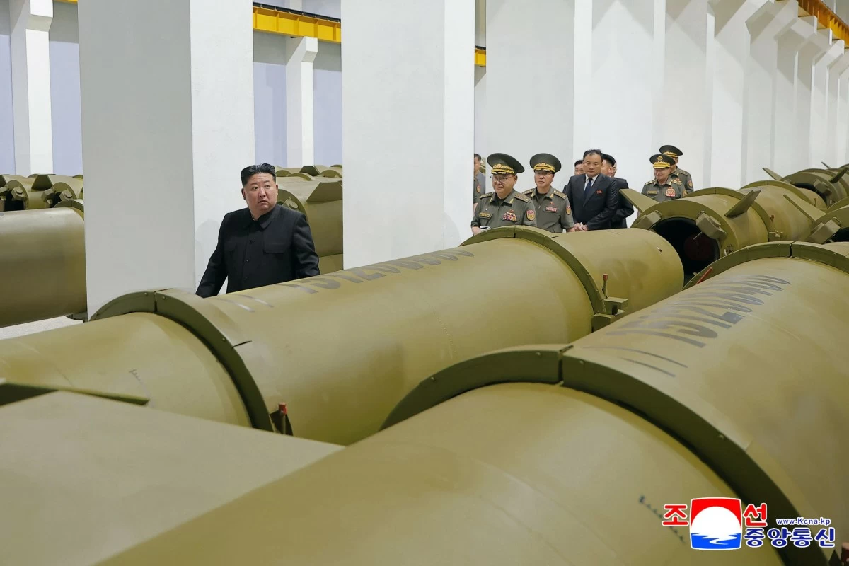 In this photo provided by the North Korean government, its leader Kim Jong Un, left, visits a weapons factory at an undisclosed place in North Korea Saturday, June 6, 2026. Independent journalists were not given access to cover the event depicted in this image distributed by the North Korean government. The content of this image is as provided and cannot be independently verified. Korean language watermark on image as provided by source reads: 