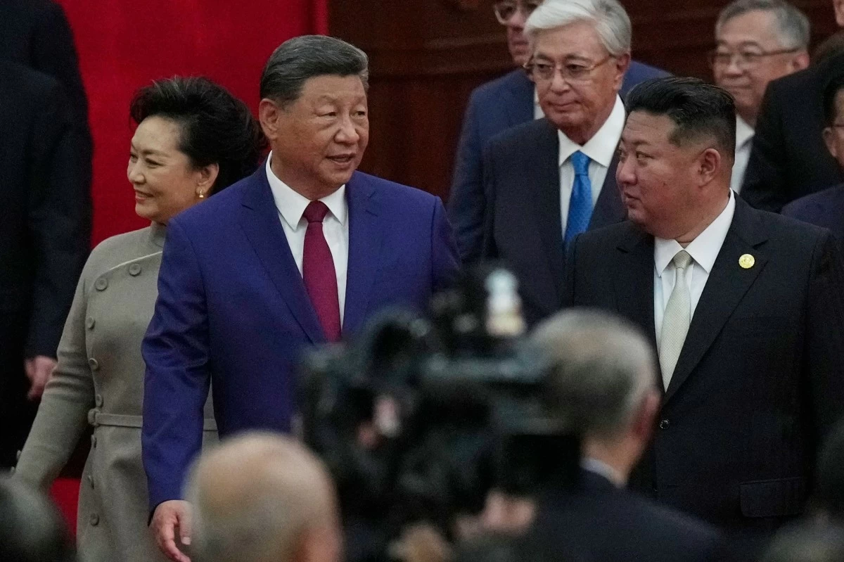 FILE - Chinese President Xi Jinping walks with North Korean leader Kim Jong Un, right, to a reception following a military parade to commemorate the 80th anniversary of Japan's World War II surrender held in front of Tiananmen Gate in Beijing, Wednesday, Sept. 3, 2025. (AP Photo/Mahesh Kumar, File)