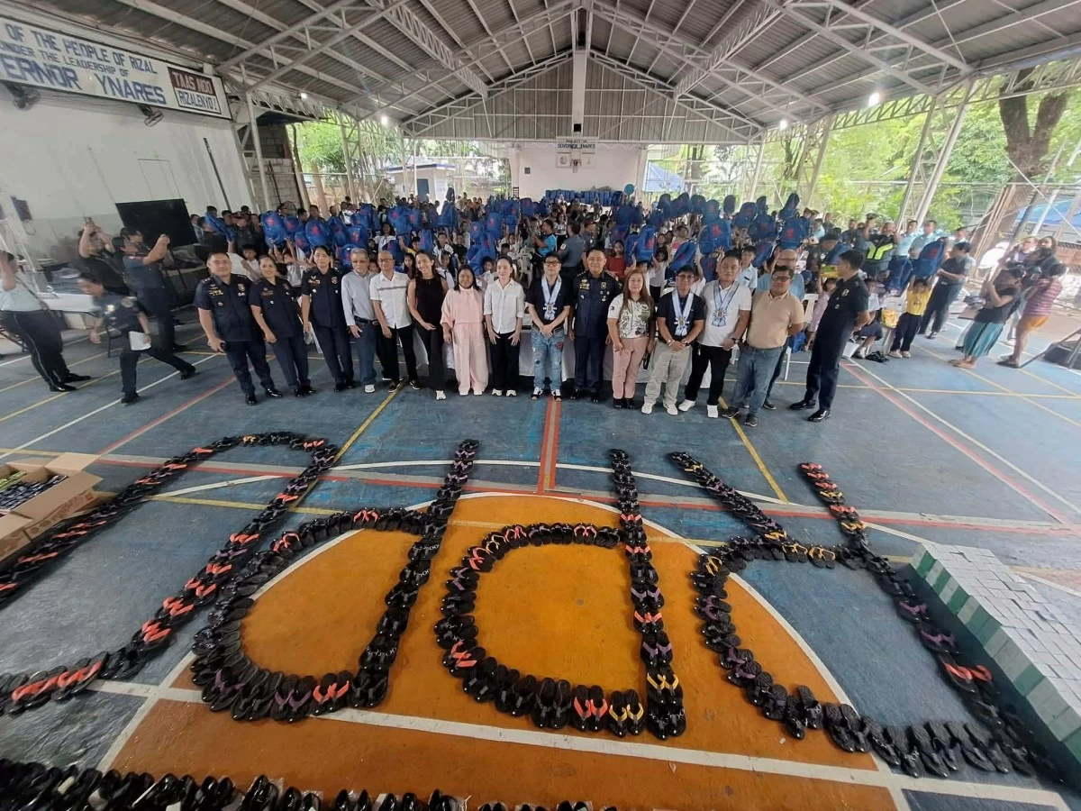 Personnel of the Rizal Police Provincial Office (Rizal PPO), under the leadership of Col. Eleazar R. Barber Jr., provincial director, distribute school supplies, shoes, and slippers to 235 elementary students. (Photos from Rizal PPO)