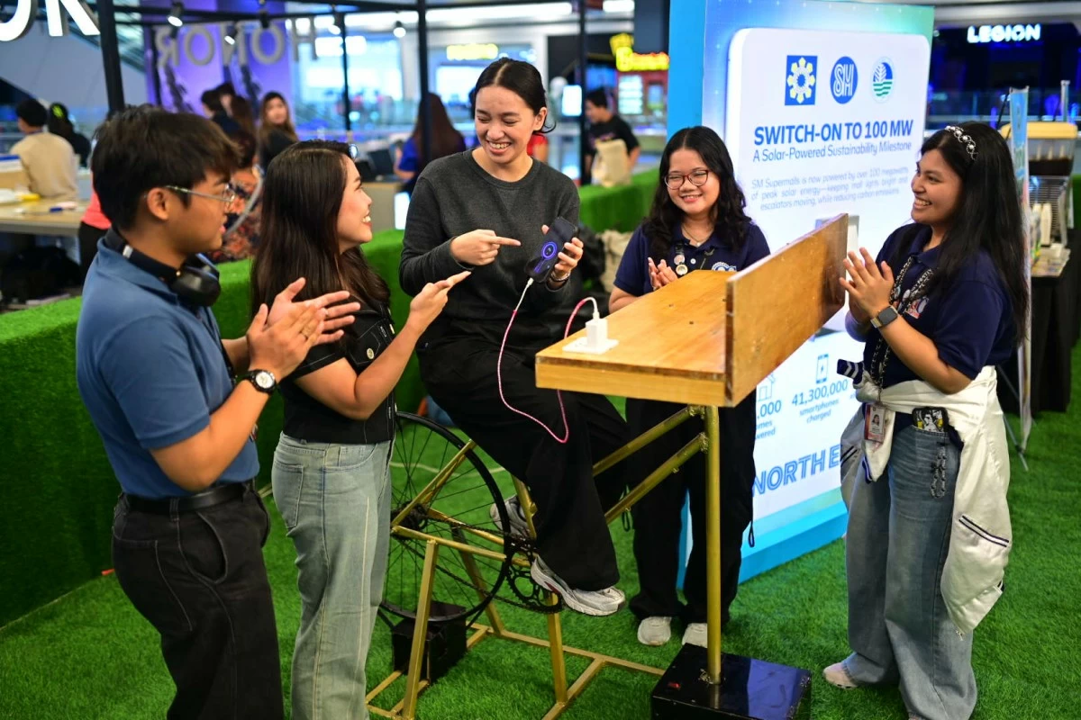 A bike-powered activity engages participants at the #SaveWATTMatters event at SM City North EDSA, showcasing how simple actions can promote energy awareness and sustainability.
