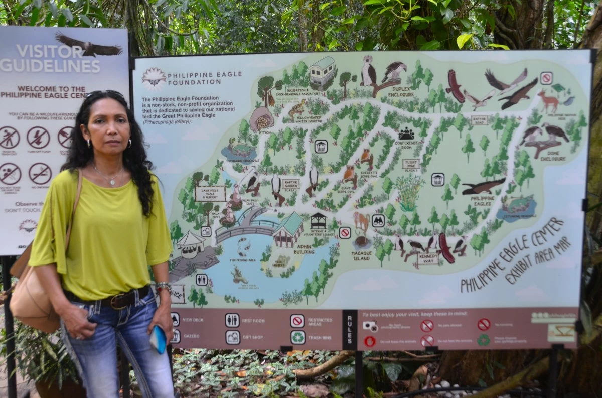 A visitor poses at the entrance of the Philippine Eagle Center in Malagos, Calinan, Davao City.
