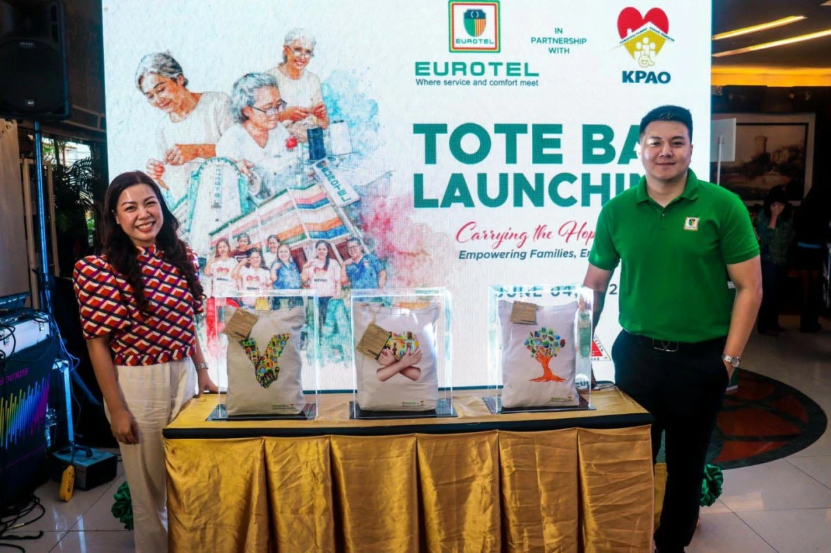 From left, Ms. Karen S. Sagun, City Government Assistant Department Head III and Director I of the Quezon City Kabahagi Center, and Mr. Christian Bona, Corporate Marketing Head of Eurotel, at the launch of the Eurotel–KPAO Tote Bag Project.