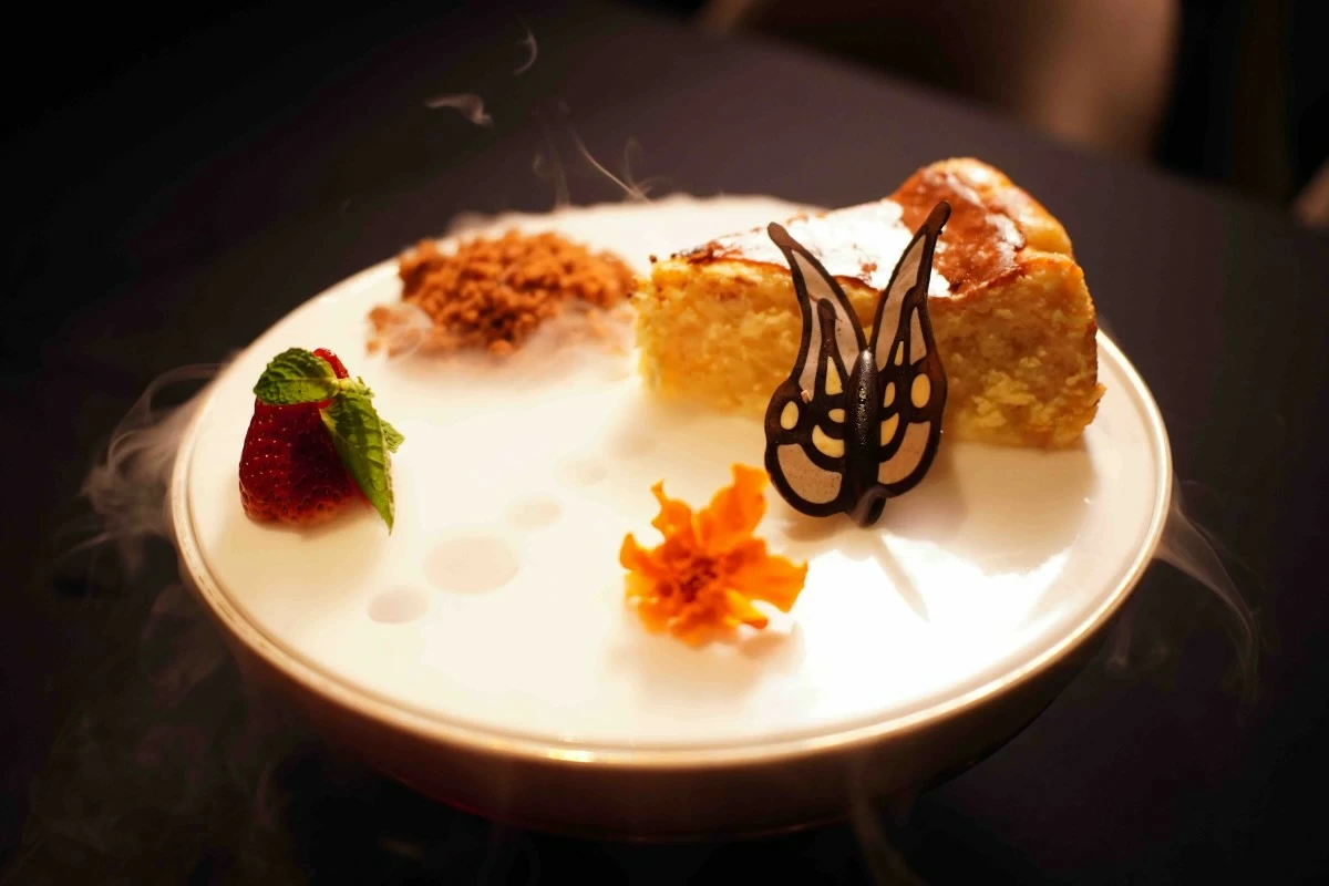 SWEET ENDING Chef Cristina Santiago's L'Amour Basque cheesecake delivers creamy richness with a delicate crunch from crumbles served on the side (Photo: Carmelo's)