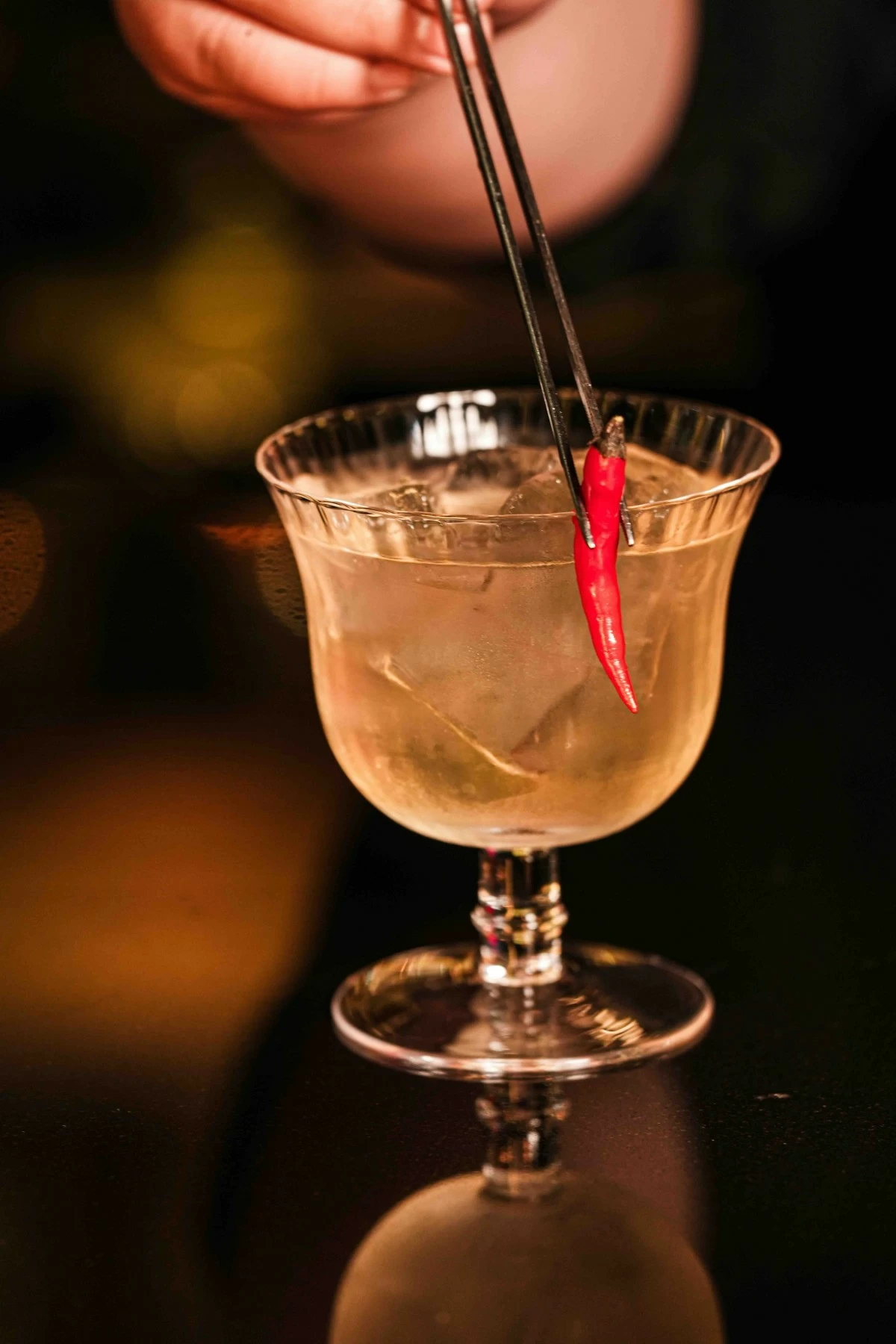 TROPICAL SPIRIT Spicy mango and tequila come together in the Tropical Burn, a cocktail designed to complement the bright flavors of seafood ceviche (Photo: Carmelo's)