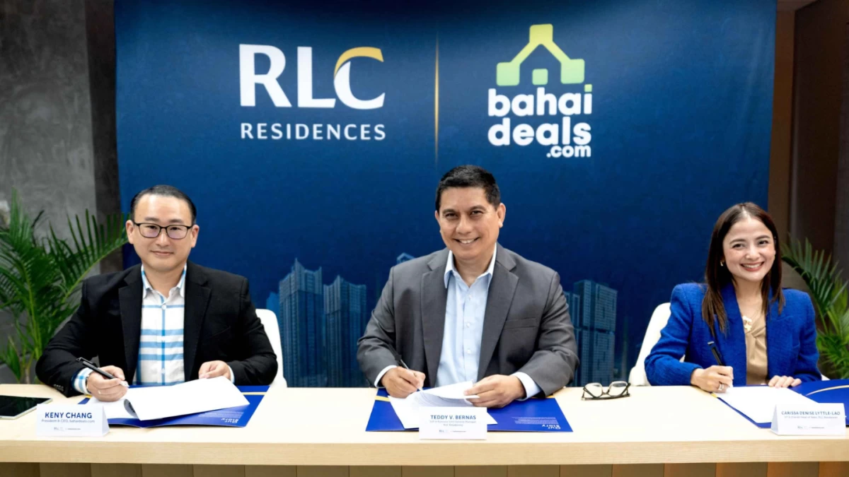 Bahaideals.com President and Chief Executive Officer Keny Chang (left), RLC Residences Senior Vice President and Business Unit General Manager Teddy V. Bernas (center), and RLC Residences Vice President and Overall Head of Sales Denise Lyttle-Lao pose during a signing ceremony at Cyberscape Alpha in Ortigas. The partnership aims to expand property access for overseas Filipinos in the US and Canada.