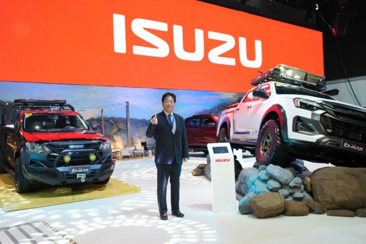 IPC President, Mikio Tsukui, in front of the Isuzu pavilion.