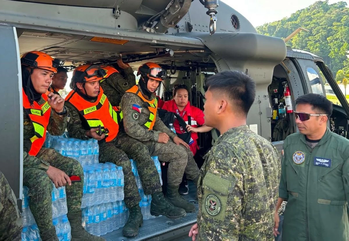 RESCUERS and relief aid are prepared for airlift to Jose Abad Santos, Davao Occidental. (DSWD-11 photo) 

