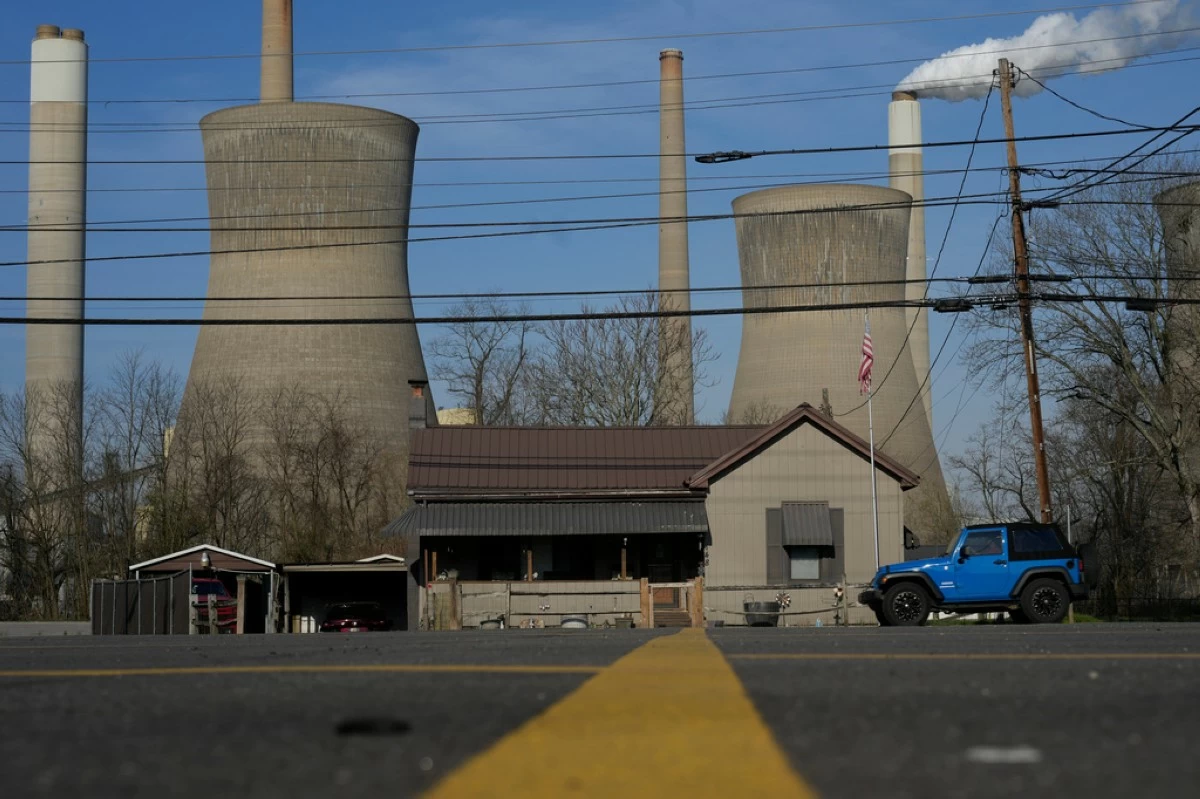 American Electric Power's John Amos coal-fired plant in Winfield, W.Va., is seen from Poca, W.Va., March 22, 2026. (AP Photo/Carolyn Kaster, File)
