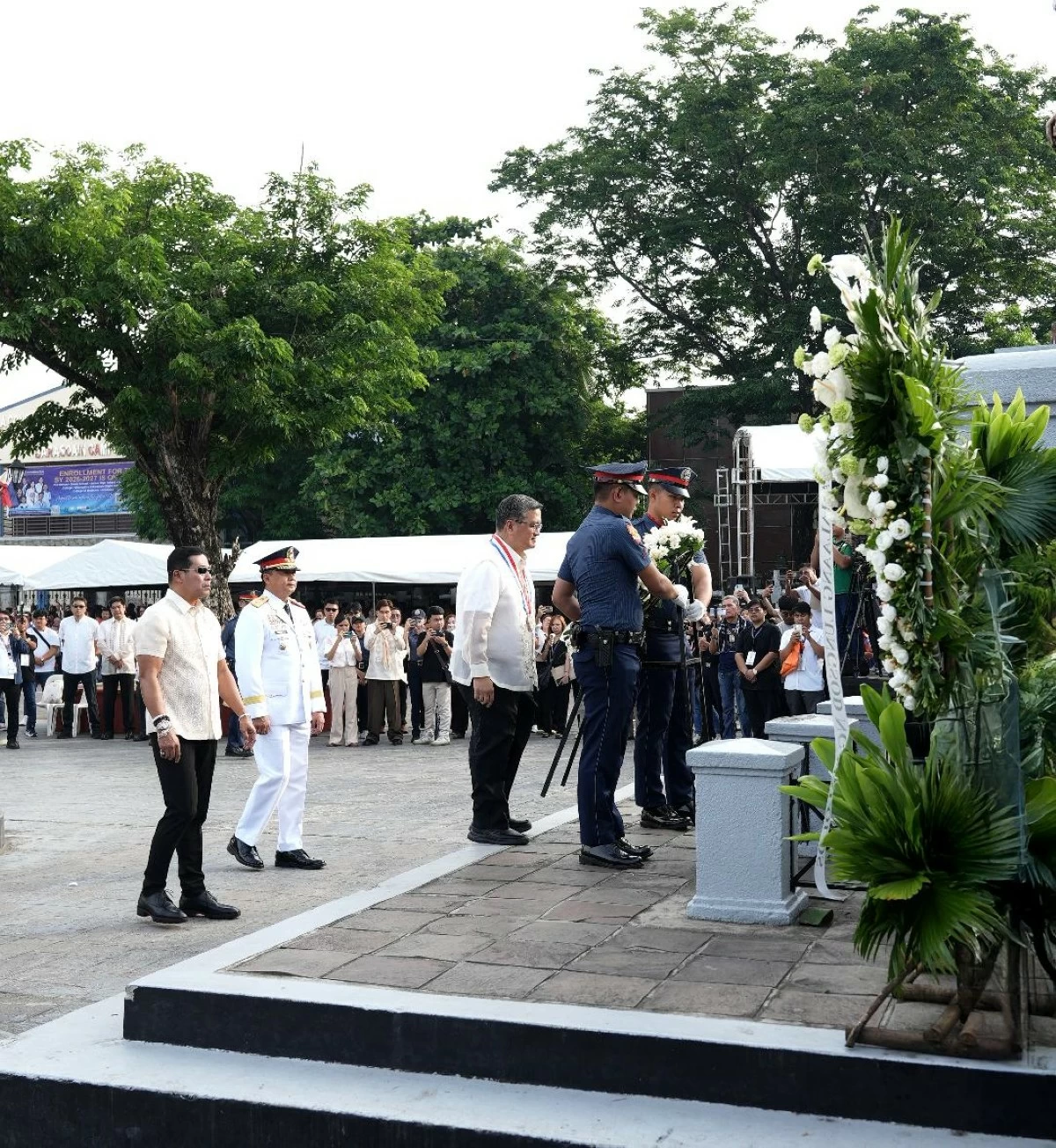 National Historical Commission of the Philippines (NHCP) Commissioner Dr. Francis M. Navarro leads the wreath-laying before the monument of General Emilio Aguinaldo, joined by Bulacan Governor Daniel R. Fernando and Region 3 Police Director Brig. Gen. Jess B. Mendez during the 128th Anniversary of Philippine Independence at Barasoain Church, Malolos City, Bulacan, on Friday, June 12, 2026. (Photo by Freddie Velez)
