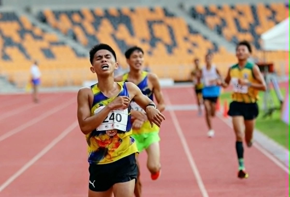 Junel Gobothia strains at the finish line after winning the men's 3,000-meter steeplechase in the ICTSI Philippine Athletic Championships at the New Clark City Athletic Stadium in Capas, Tarlac.