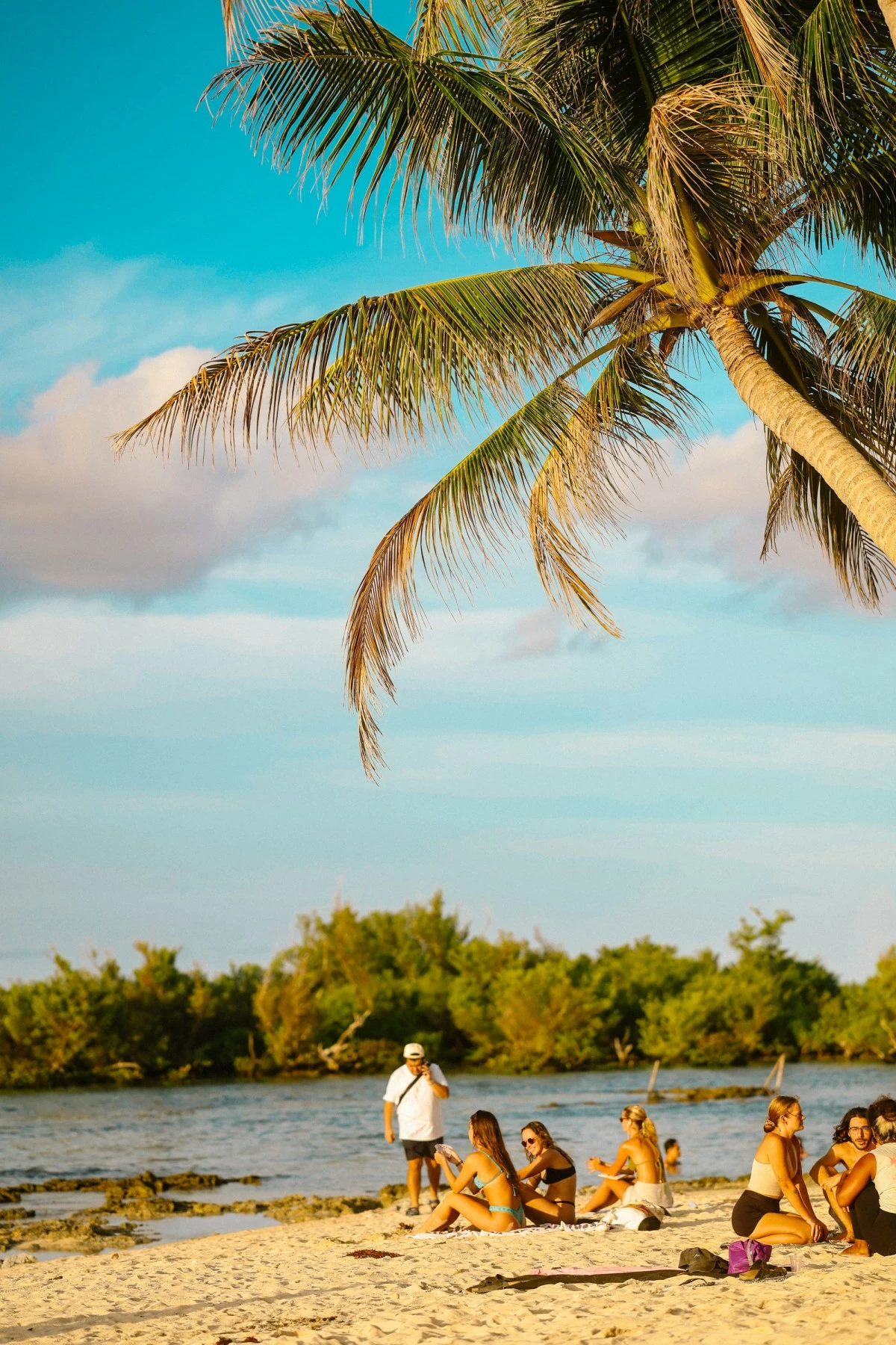 BEACH BLISS Sand, swaying palms, and rolling waves capture the laid-back rhythm of life in Siargao (Photo: Magic Liwanag)
