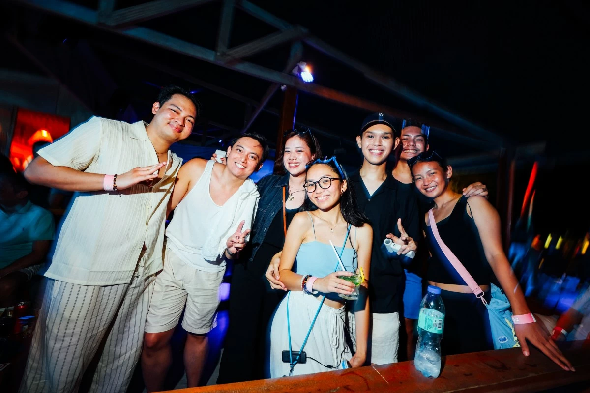 ISLAND BEATS The author, second from left, joins fellow guests at the final night party at Siargao Beach Club, capping off a weekend in paradise (Photo: Magic Liwanag)