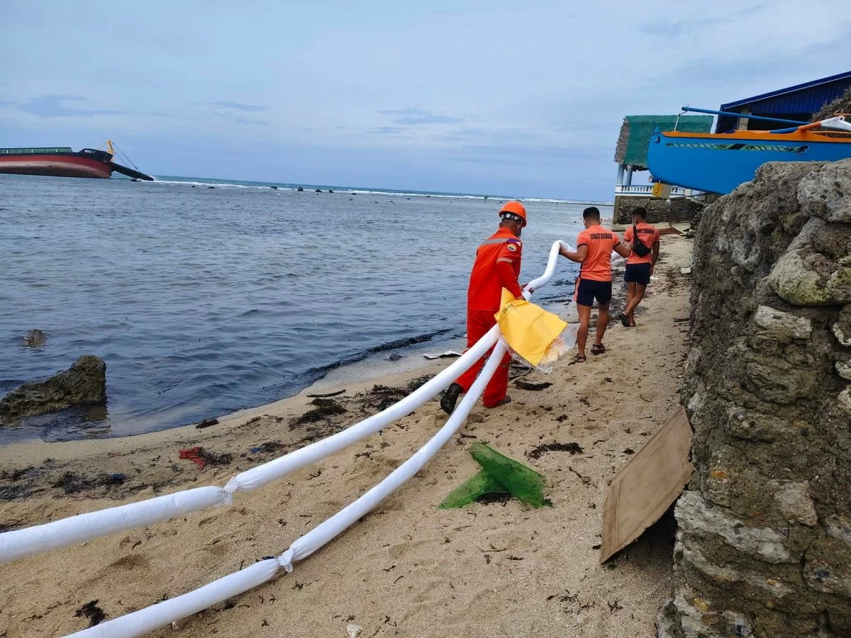 AUTHORITIES working to contain the oil spill in Ilocos Norte. (FB)