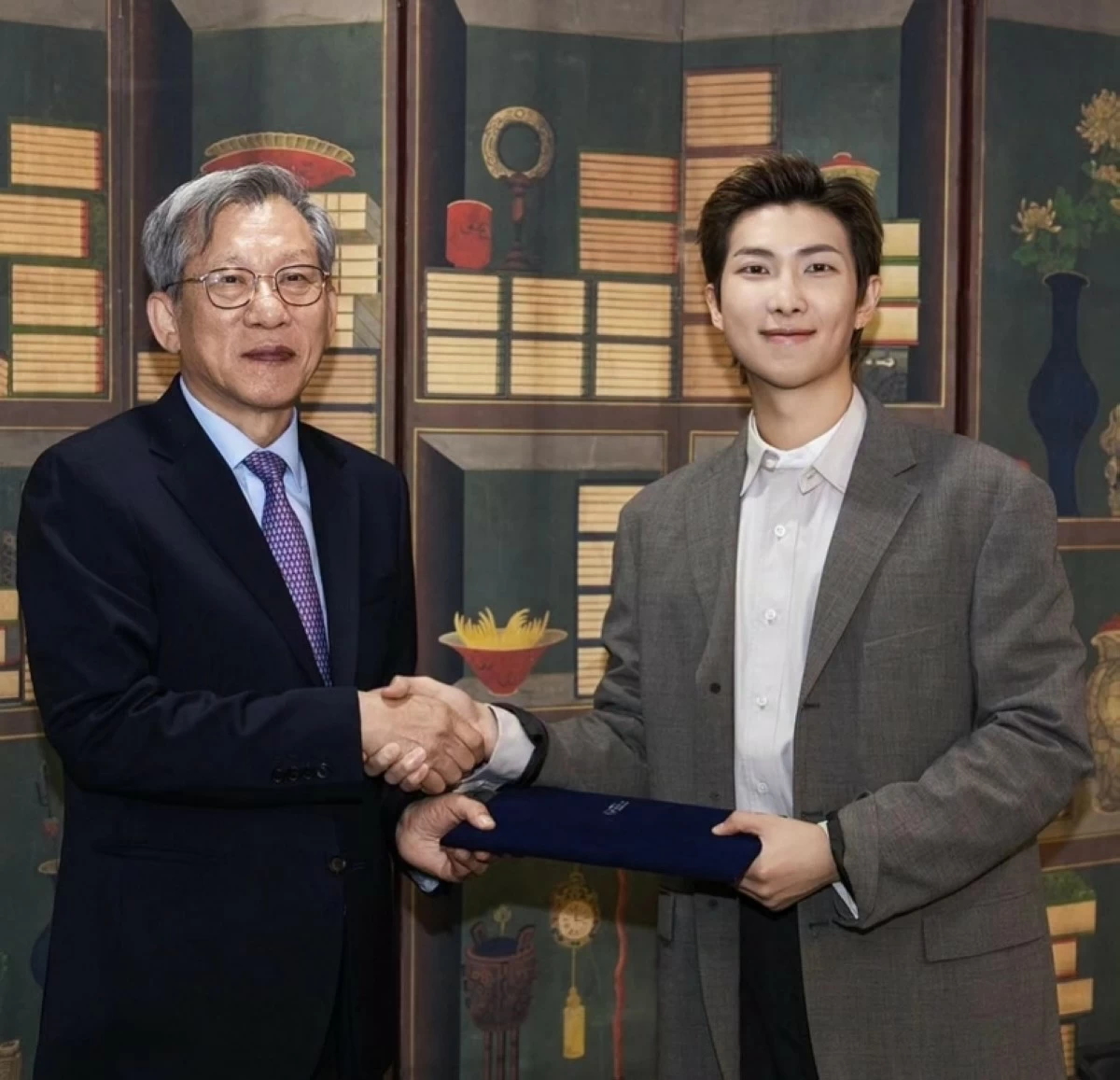 BTS' RM (right) with National Museum of Korea Director Yoo Hong-joon (Photo from the museum's Facebook page) 