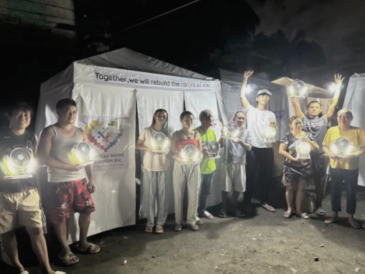 Residents of Purok 20, Barangay Lagao, General Santos City, display the solar-powered lamps and fans donated by the Color Your World Foundation, providing light, ventilation, and comfort for families staying in temporary tents amid continuing aftershocks. 
