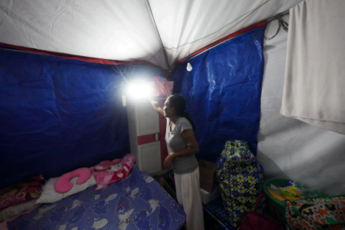 One of the beneficiaries of Color Your World Foundation’s solar-powered light and tent in Purok 20, Barangay Lagao, General Santos City on June 14, 2026. 