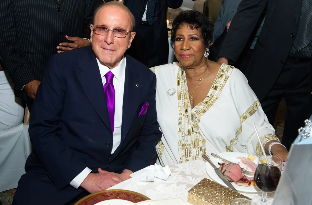 Clive Davis, left, appears with Aretha Franklin at Aretha’s 69th birthday party, in New York, Friday, March 25, 2011. (AP Photo/Charles Sykes, File)