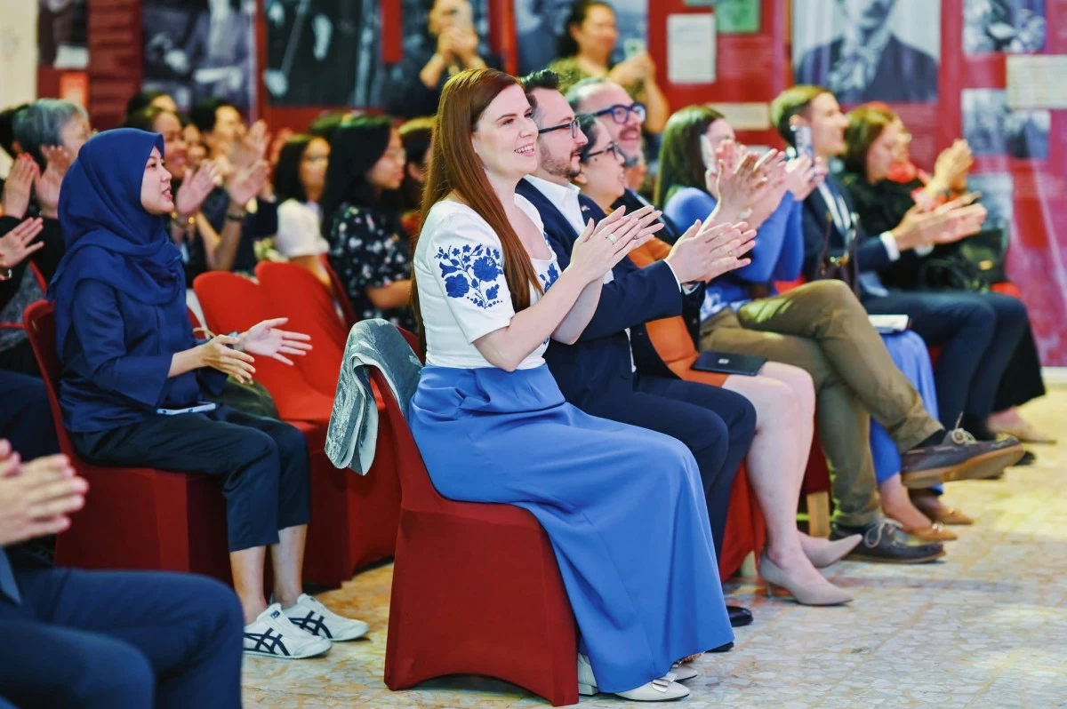 Ambassador Dr. Titanilla Tóth enjoys the performance along with other guests