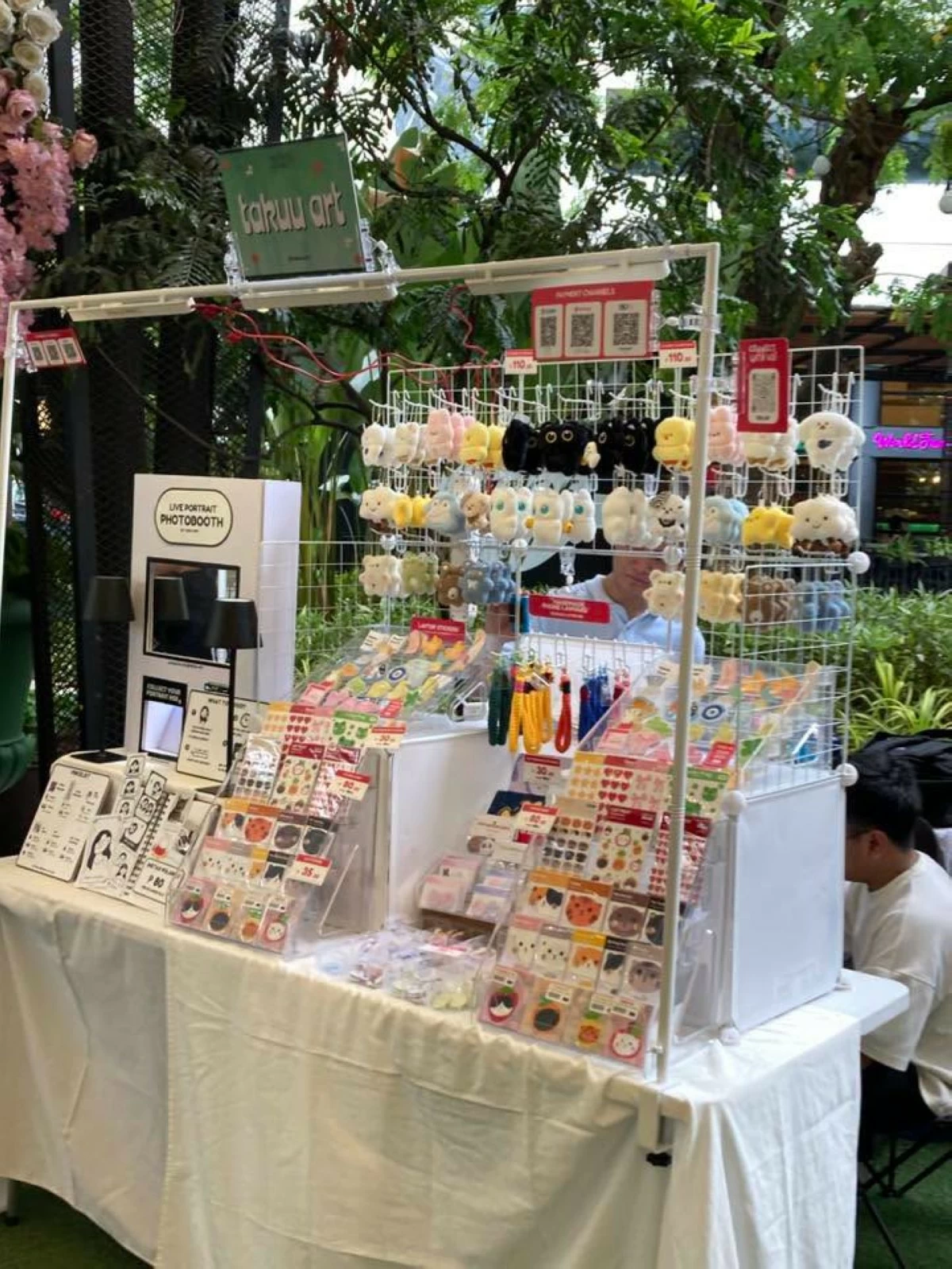 TRINKETS GALORE Stickers, phone accessories, and mini plushes were also available