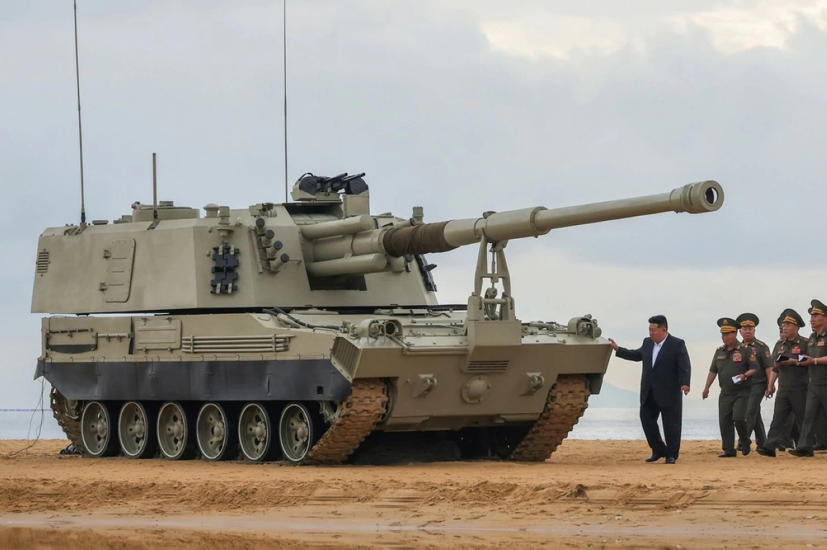 In this photo provided Friday, June 26, 2026, by the North Korean government, its leader Kim Jong Un, center right, visits the site of weapon tests at an undisclosed location, North Korea, Thursday, June 25, 2026. (Korean Central News Agency/Korea News Service via AP)