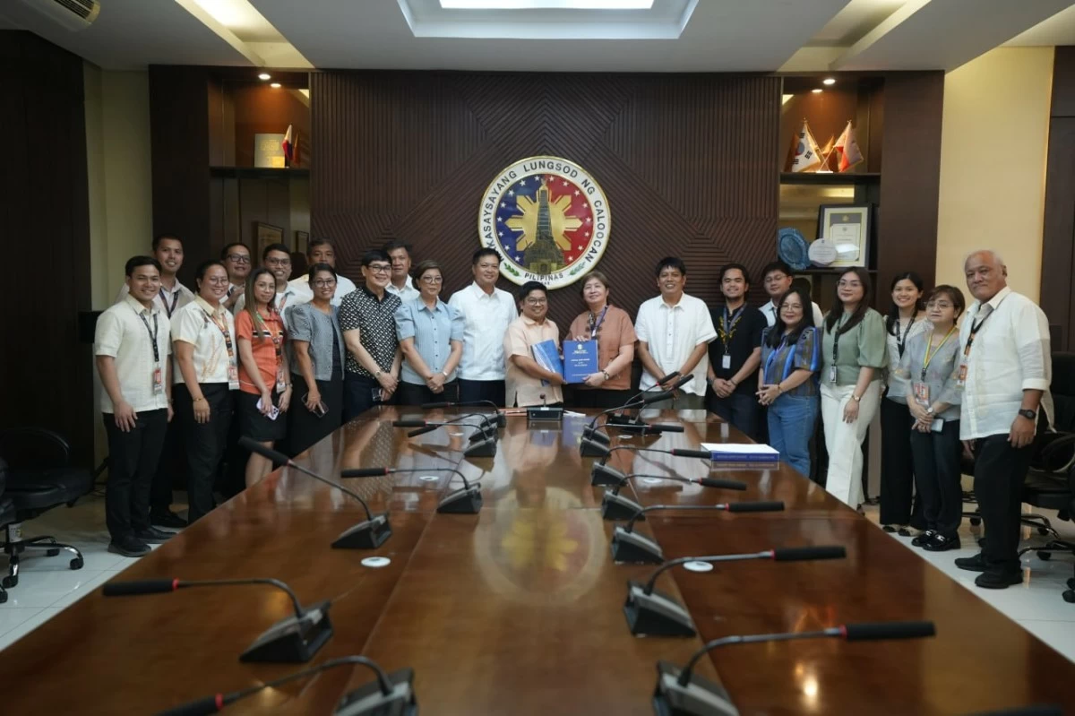 Caloocan City officials pose for a photo following the turnover of the Commission on Audit’s Unmodified Opinion on the city's 2025 financial statements. (Photo from Caloocan LGU)