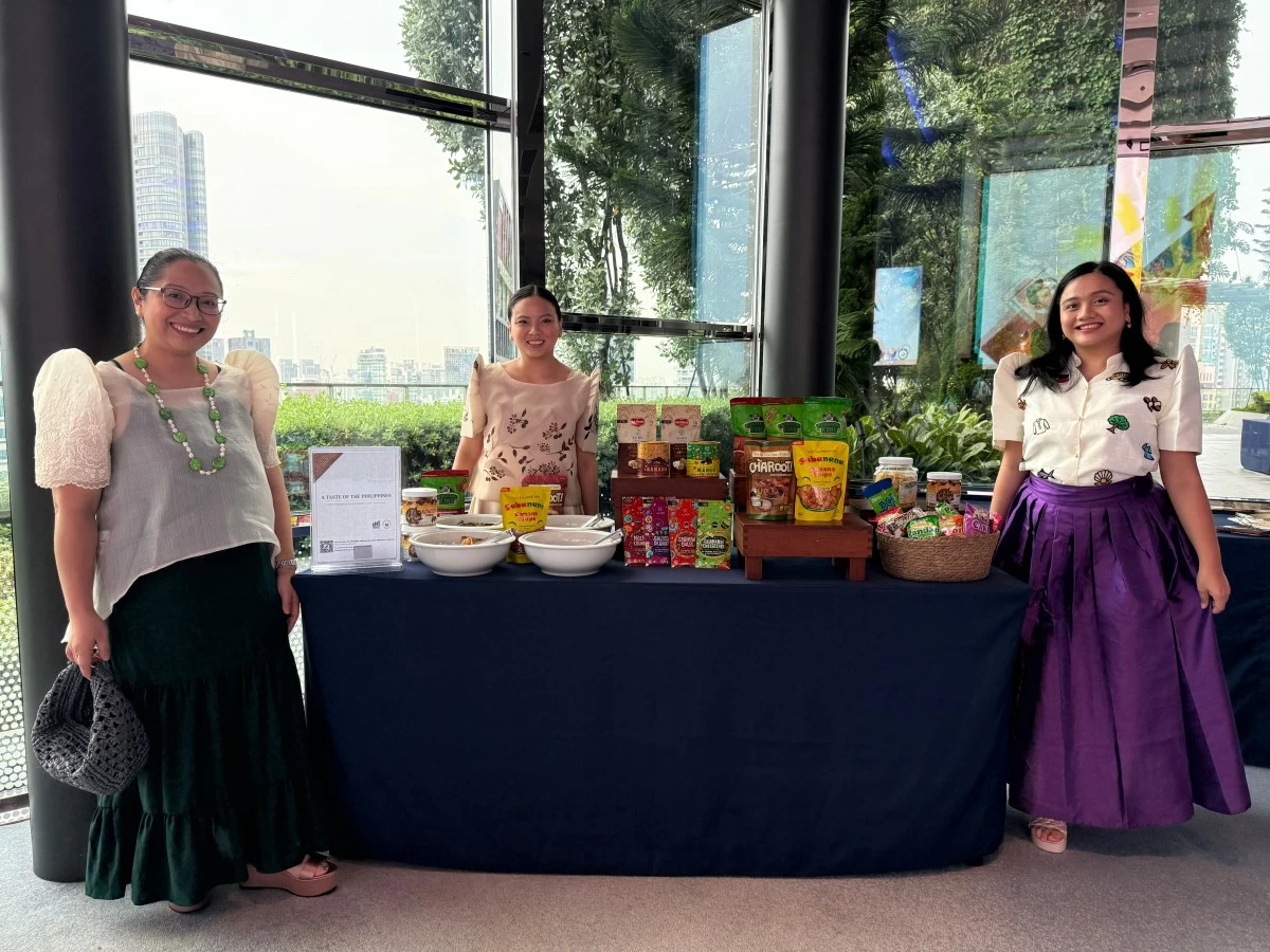 PTIC-Singapore Commercial Counselor Carla Grepo, alongside team members Denise Dayon-Ong and Luz Wendy Noble, organized the “Taste of the Philippines” product display and curated gift sets for the country's 128th Independence Day reception.