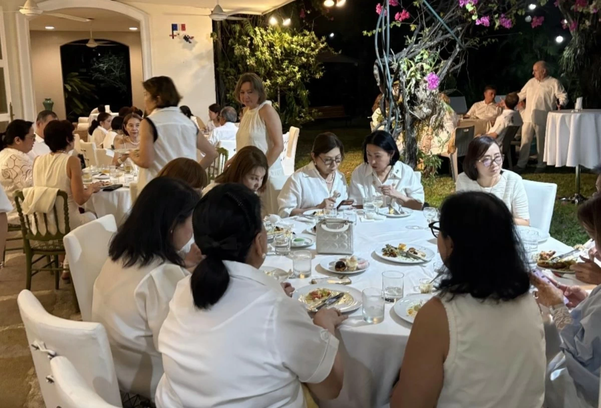 The low buzz of lively exchanges filled the air as guests in radiant white embodied peace, unity, and the spirit of celebration.