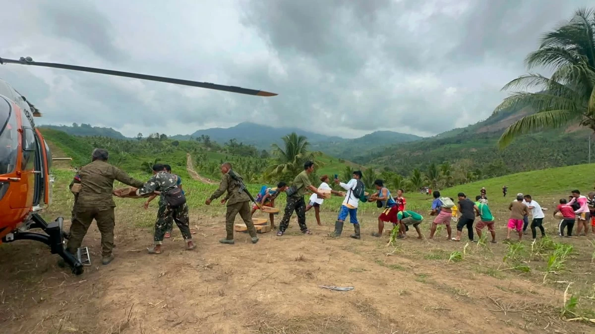 Personnel of Coast Guard Aviation Command (CGAVCOM) and volunteers unload boxes of relief goods from their CGH-1452 aircraft for victims of the magnitude 7.8 earthquake in Barangay E. Alegado, Glan, Sarangani province on June 26, 2026. (Photo: Philippine Coast Guard)