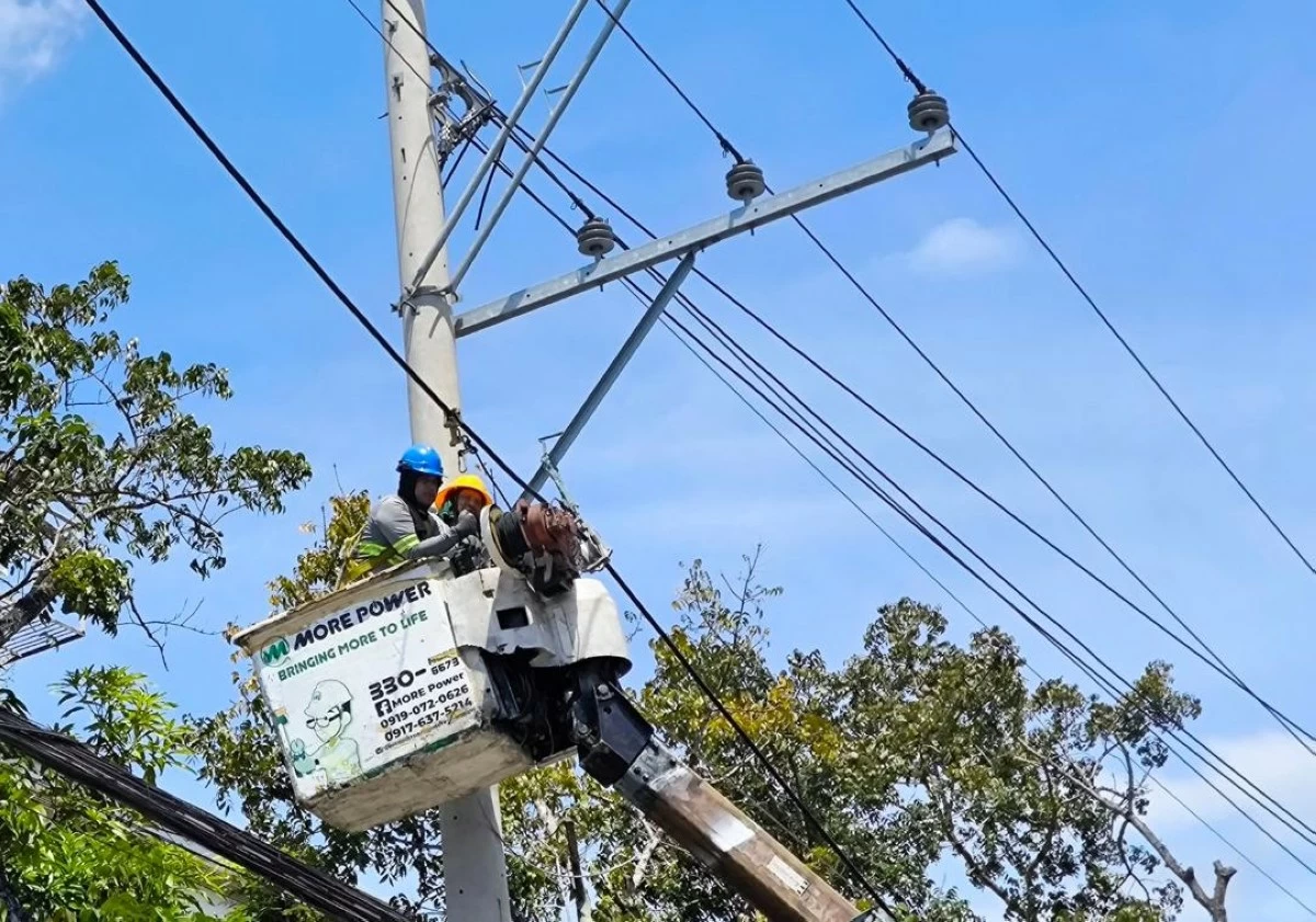 MORE Power line men.  (Tara Yap)
