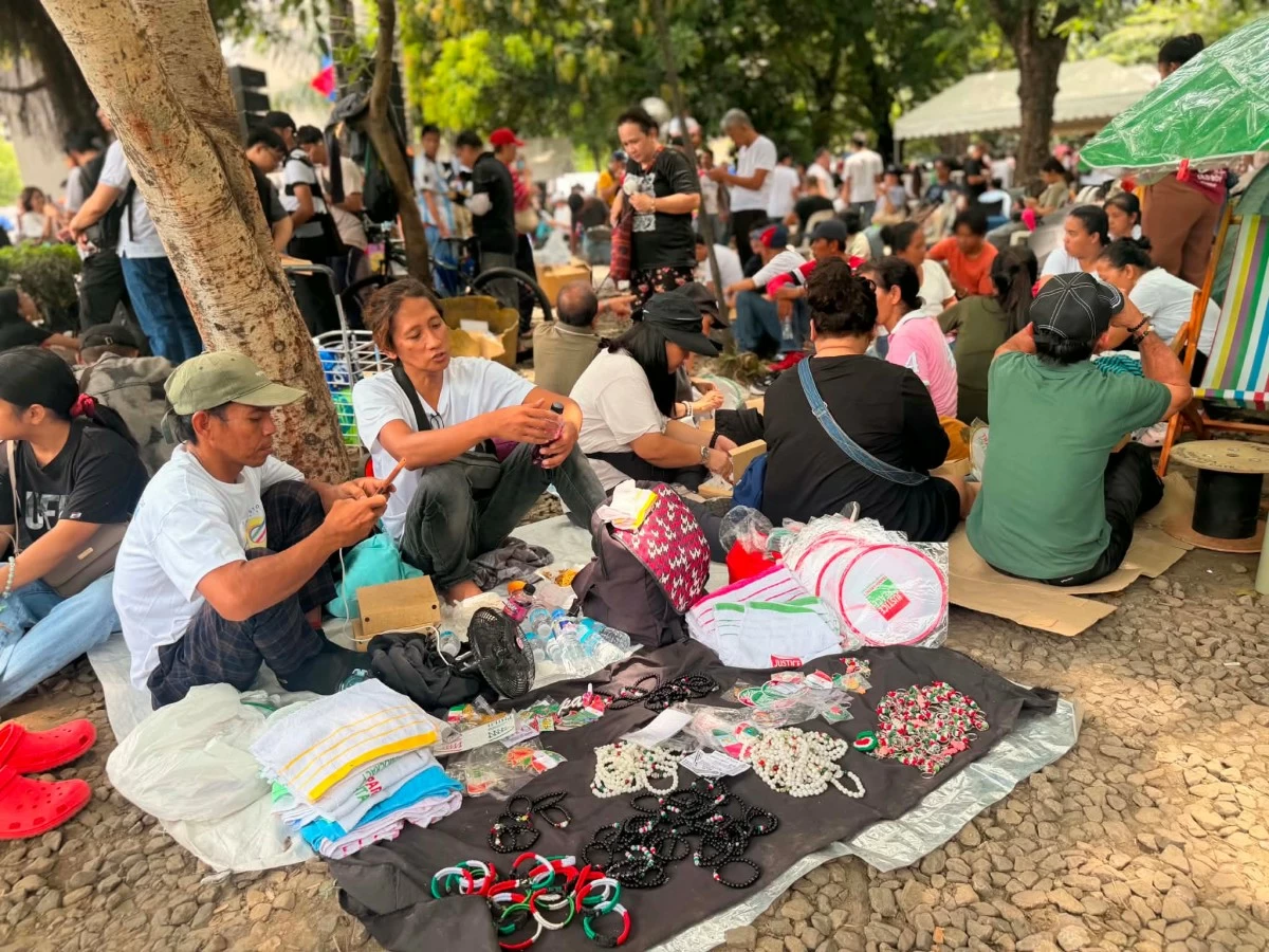 Members of the Iglesia Ni Cristo continue to gather at Liwasang Bonifacio, with attendees arriving early to await the start of the peace rally program. (Photos by Diann Calucin)
