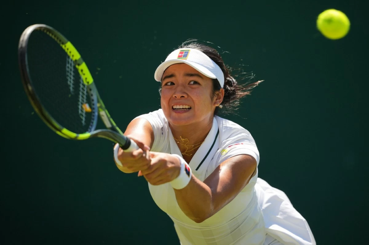 Alexandra Eala of the Philippines returns the ball during the second round women's singles match against Maya Joint of Australia at the Wimbledon Tennis Championships in London, Thursday, July 2, 2026.(AP Photo/Kin Cheung)