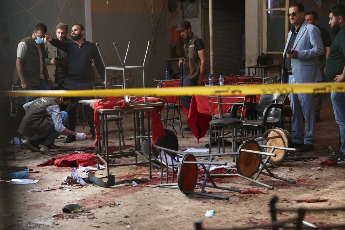 Syrian security inspects the site after an explosive device was detonated in a cafe near the main courthouse complex, in Damascus, Syria, Thursday, July 2, 2026 (AP Photo/Ghaith Alsayed)