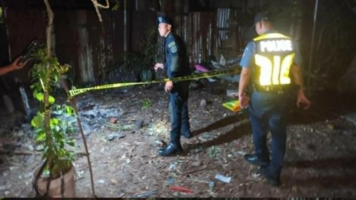 Police secure the area where the vintage mortar cartridge was found in Taguig. (Photo from Taguig police / SPD)