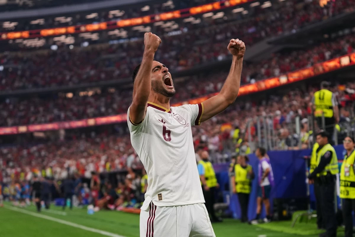 Spain's Mikel Merino (6) celebrates scoring his side's opening goal during the World Cup round of 16 soccer match between Portugal and Spain in Arlington, Texas, near Dallas, Monday, July 6, 2026. (AP Photo/Julio Cortez)