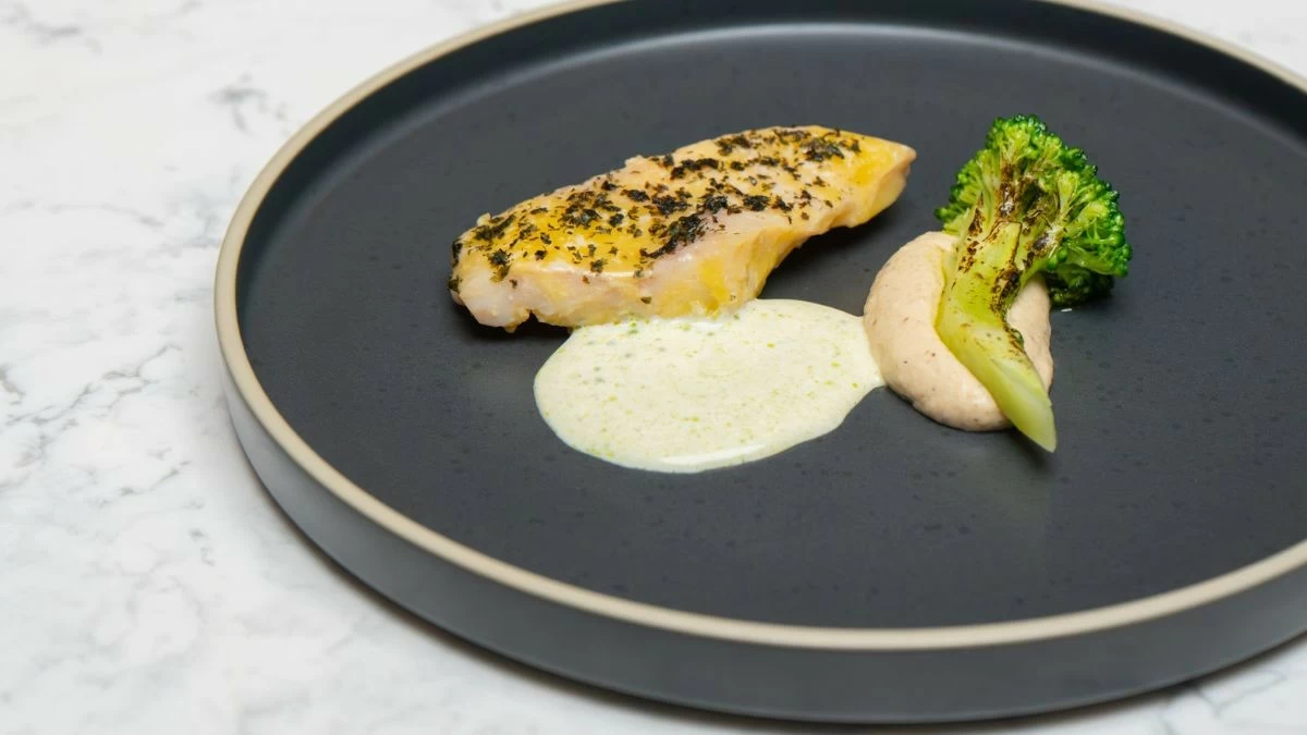COCOA BUTTER  Grouper poached in Misamis cocoa butter and miso is served with burnt cauliflower, seaweed powder, and glazed broccoli during the winnowing course (Photo: The Westin Manila)
