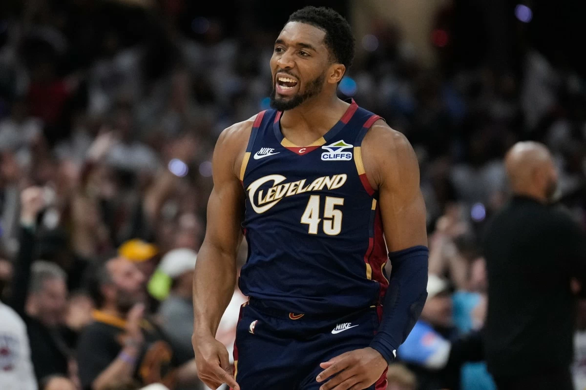 FILE - Cleveland Cavaliers' Donovan Mitchell (45) gestures after hitting a three-point basket inthe second half of Game 4 of a second-round NBA basketball playoff series against the Detroit Pistons, May 11, 2026, in Cleveland. (AP Photo/Sue Ogrocki, File)