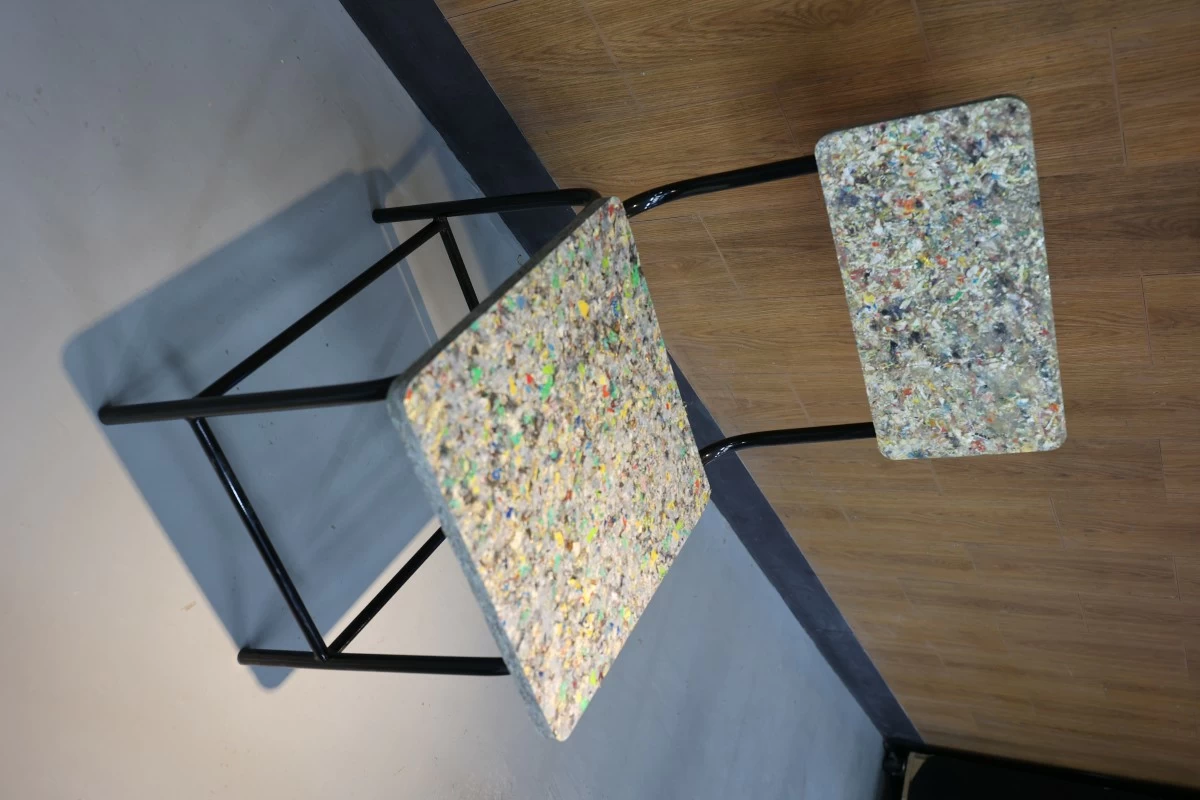 A chair crafted from Restore Boards made with materials collected through Smart Eco-Collection Bins.
