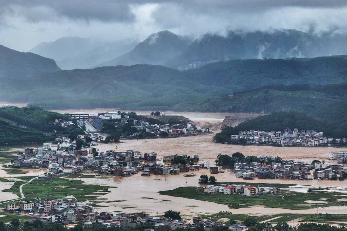 This photo released by Xinhua News Agency, shows flooded villages after the Liulan Reservoir breached due to heavy rains in Hengzhou, Nanning City, south China's Guangxi Zhuang Autonomous Region on Monday, July 6, 2026. (Cao Yiming/Xinhua via AP)