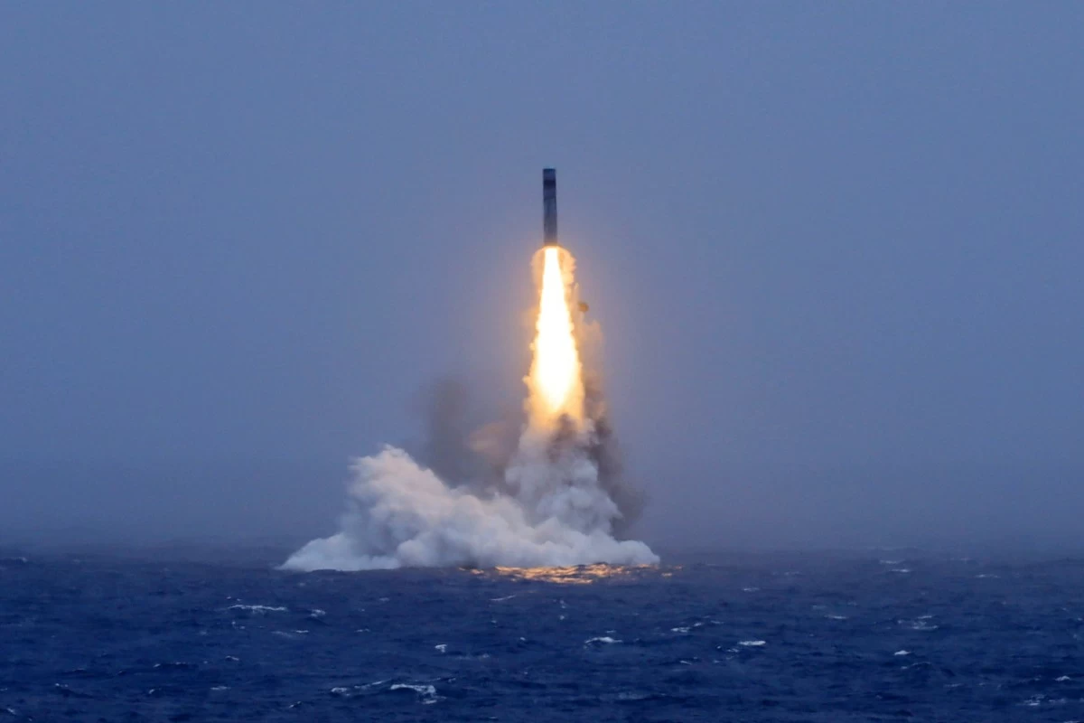 In this photo released by Xinhua News Agency, a long-range ballistic missile bursts out of the sea during a test launched from a Chinese nuclear-powered submarines in the South Pacific on Monday, July 6, 2026. (Li Xiangchao/Xinhua via AP)