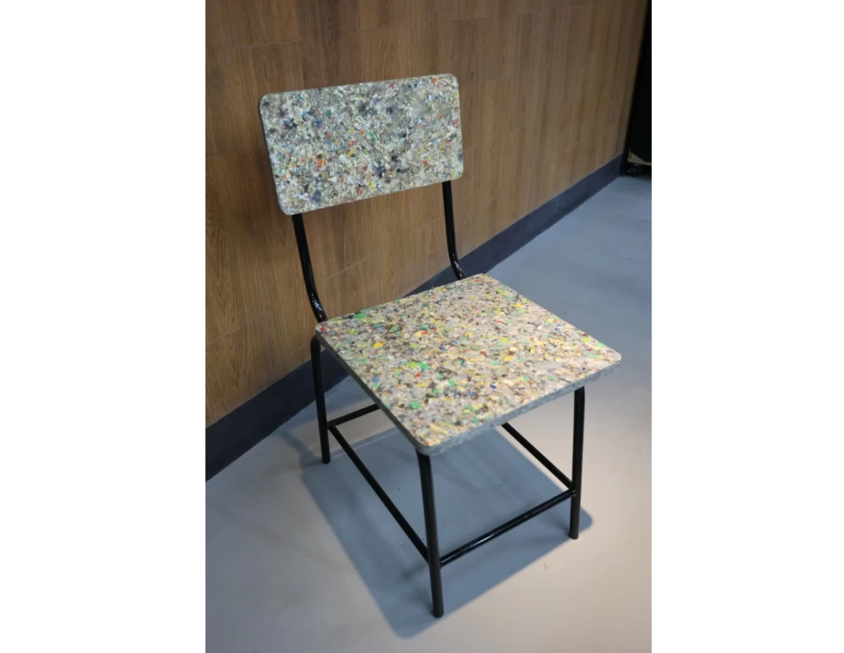 A chair crafted from Restore Boards made with materials collected through Smart Eco-Collection Bins.