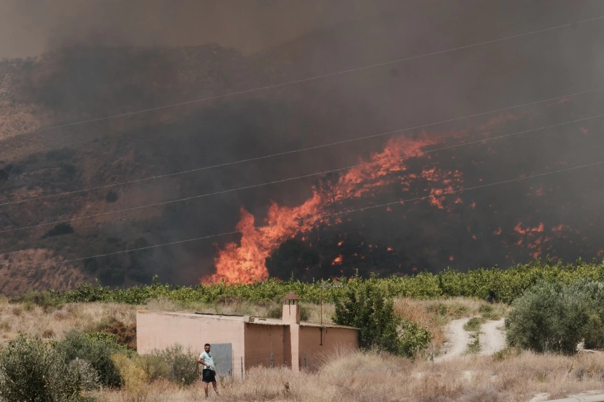 A wildfire rages in Alfajir, near Almeria in southeastern Spain, Friday, July 10, 2026. (AP Photo/Gregorio Marrero)