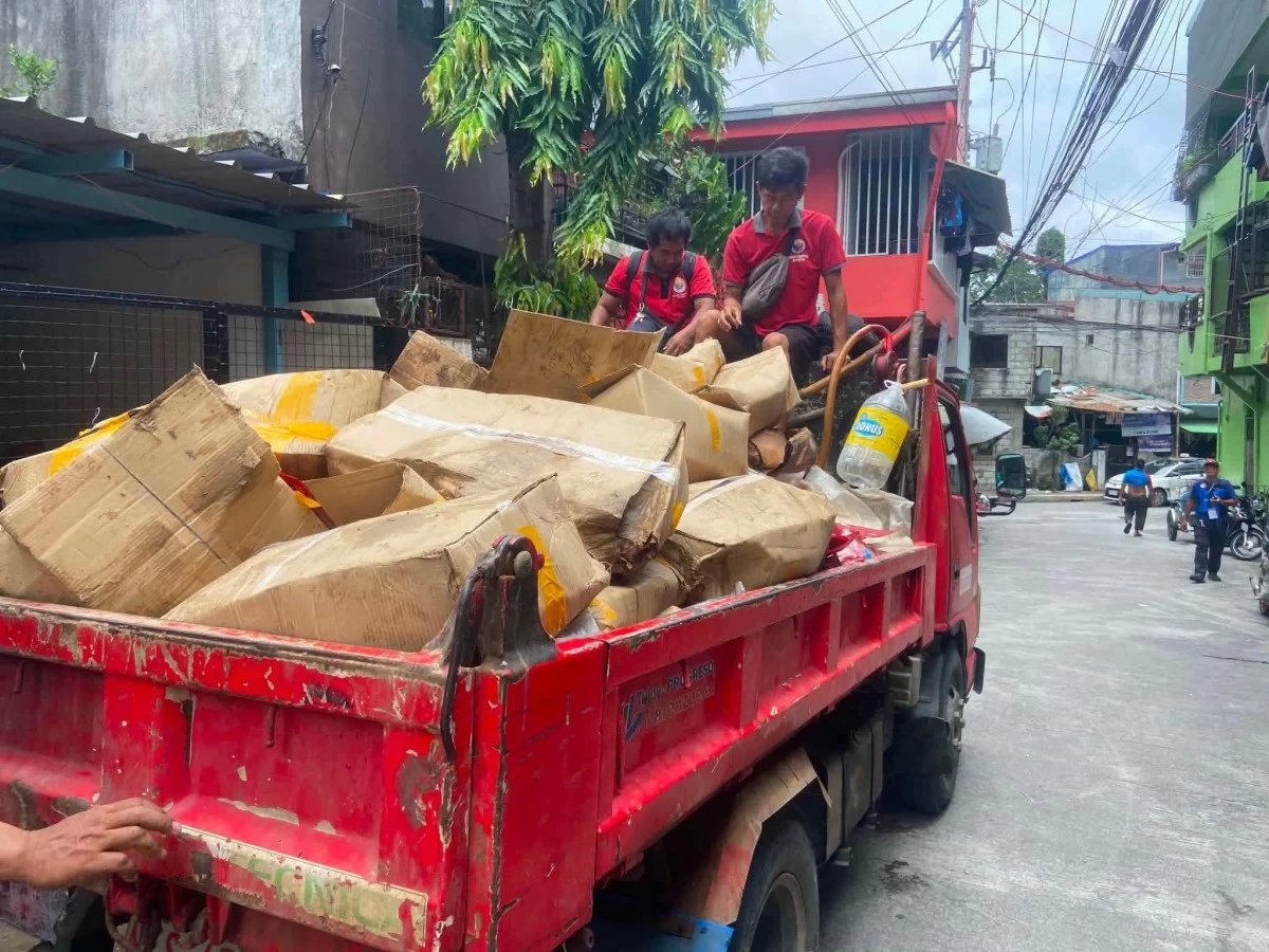 Authorities load boxes of expired meat and food products onto a truck following separate inspection operations conducted by the Valenzuela City Veterinary Services Office (CVSO), National Meat Inspection Service (NMIS), and National Bureau of Investigation (NBI). (Photo from Valenzuela PIO)