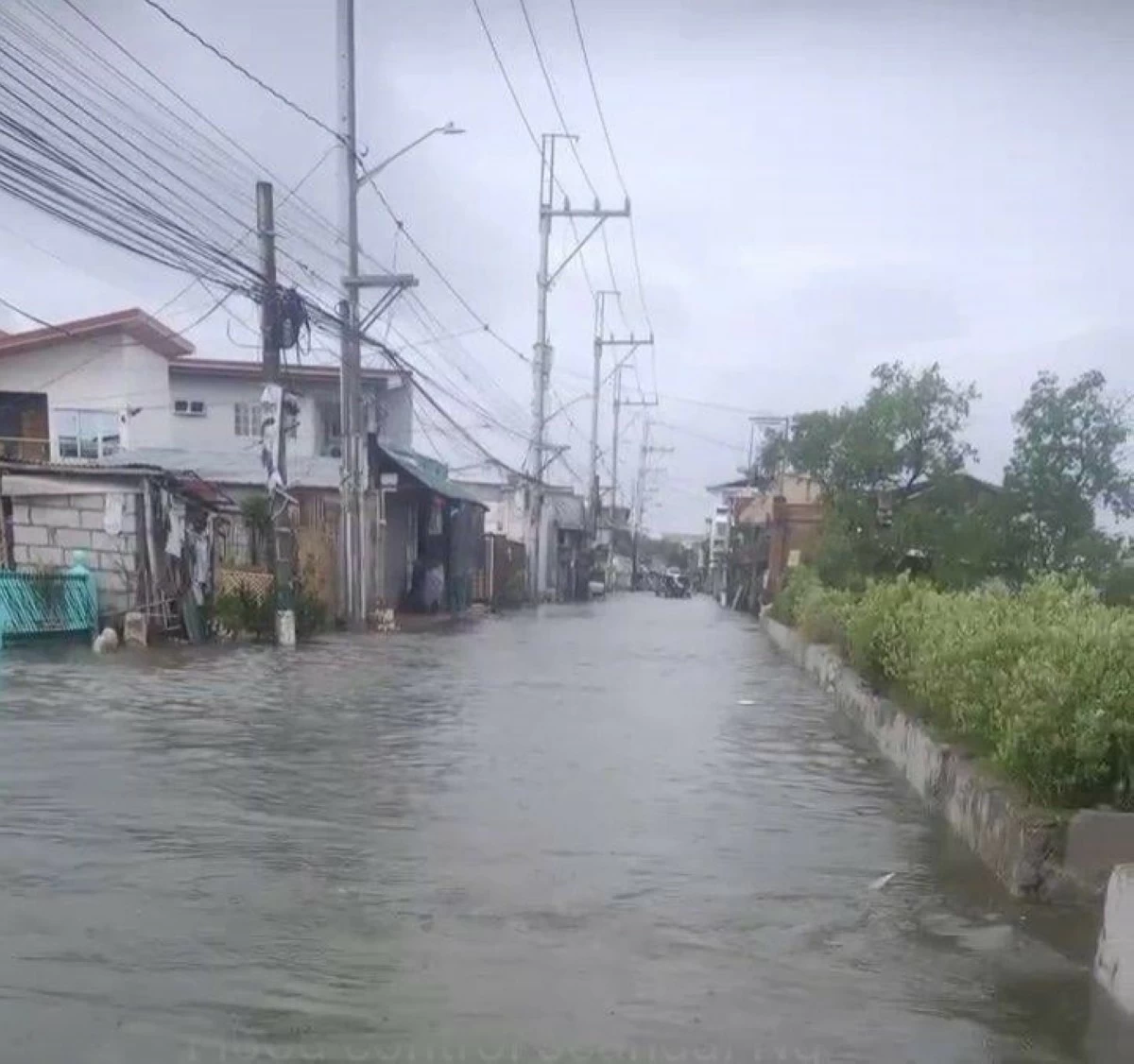 Floodwaters cover a road in Hagonoy, Bulacan during high tide on Sunday, July 12. (Photo courtesy of Ace Cruz)