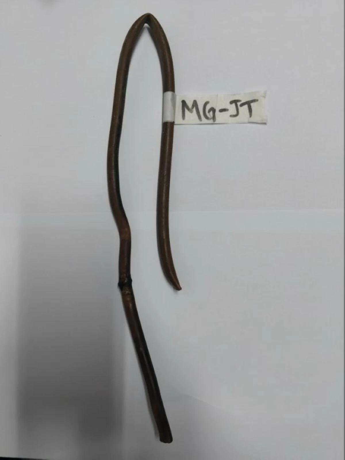 The cut copper tube allegedly taken from an outdoor air conditioning unit at a Quezon City diagnostic center is shown after it was recovered by police. (Photo courtesy of the Quezon City Police District)